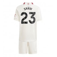 Camiseta Manchester United Luke Shaw #23 Tercera Equipación Replica 2023-24 para niños mangas cortas (+ Pantalones cortos)